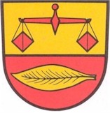 Rote Waage auf gelbem Hintergrund, gelbes Tabakblatt auf rotem Hintergrund
